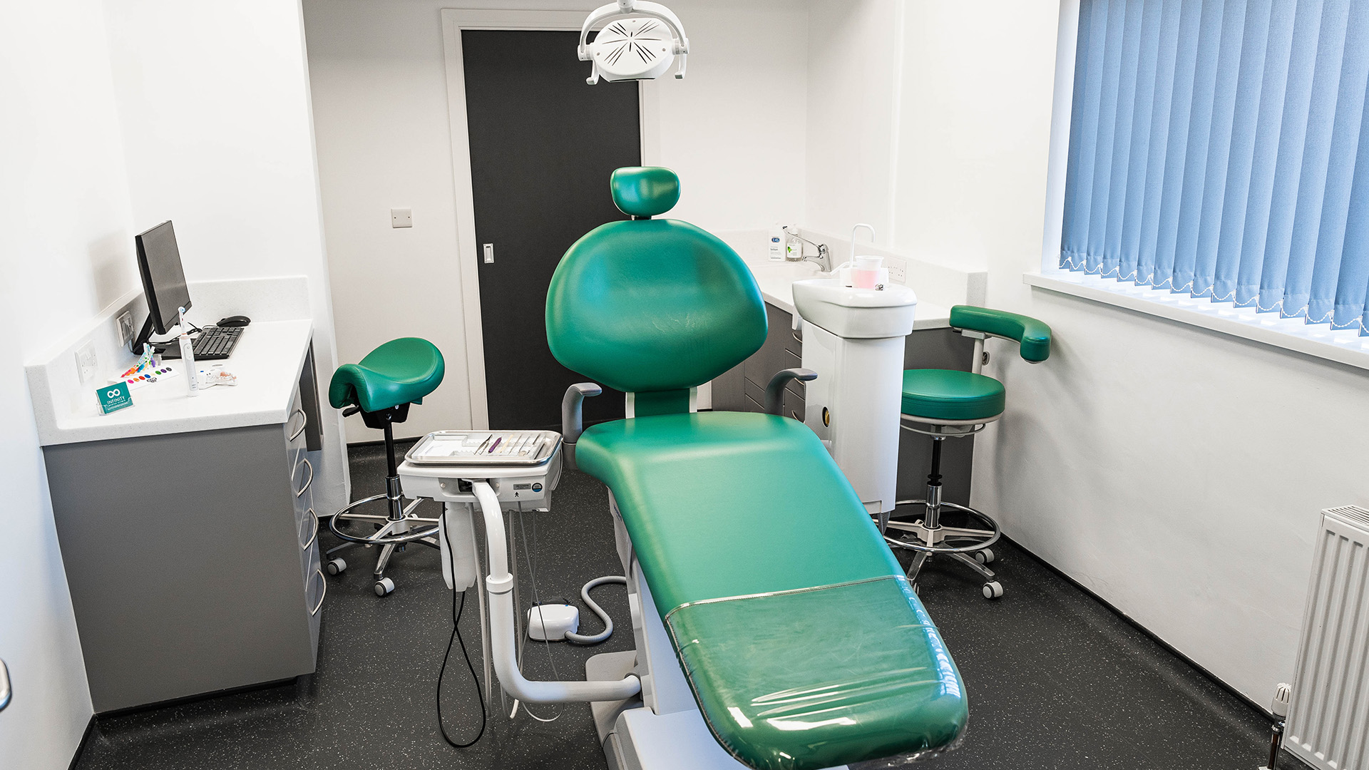 The interior of a treatment room at Infinity Dental Clinic.