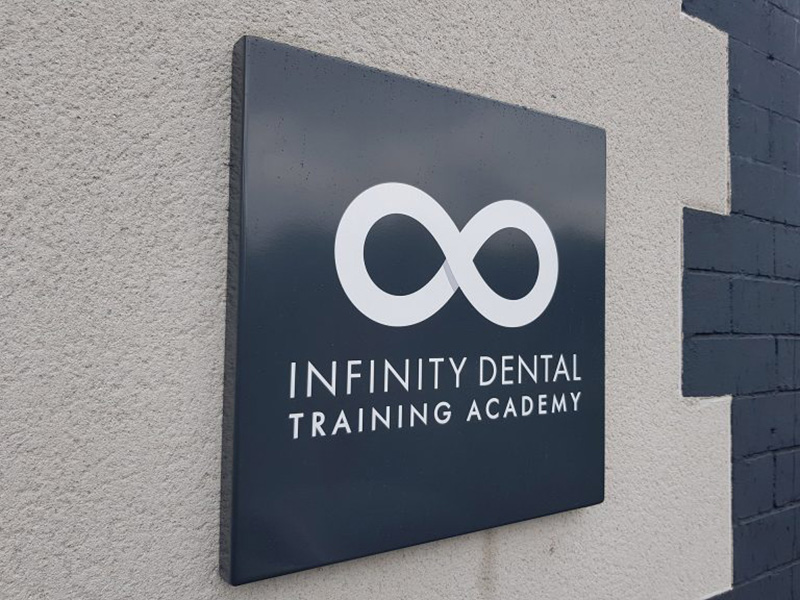 The Infinity Dental Training Academy sign.